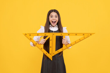 angle degree measurement. surprised teen girl hold ruler. back to school. algebra and geometry.