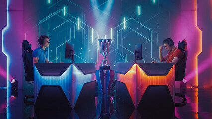 Two Professional Esport Gamers Competition in a Video Game on a Championship Arena, One Loses Round Disappointingly and Second Celebrates with Triumph. International Online Cyber Gaming Tournament  © Gorodenkoff