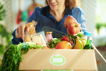 Closeup on smiling woman in kitchen