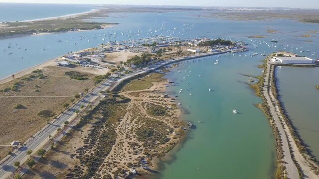 Aerial View of Boats Floating At Bay Of Cadiz Near The Beach In Chiclana de la Frontera, Spain.