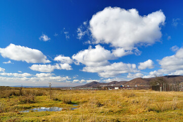 Fototapeta premium Spring landscape after rain, intense blue sky and clouds