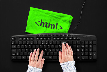 Hyper Text Markup Language. woman hands on pc keyboard and html tag on rag