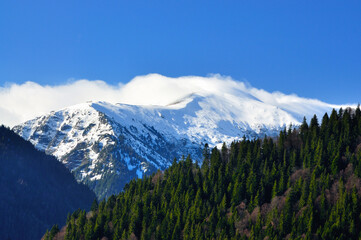 Snow filled mountain peaks in late spring.
