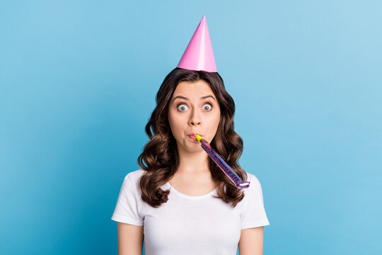 Photo Of Young Attractive Girl Wear Birthday Cone Blow Noisemaker Whistle Congrats Party Isolated Over Blue Color Background