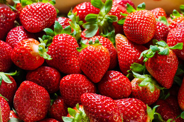 Composition of strawberries inside a box. Background of strawberries
