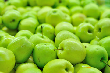Golden apples close up in market.