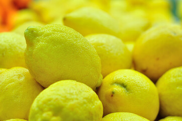 Colorful Display Of Lemons In Market