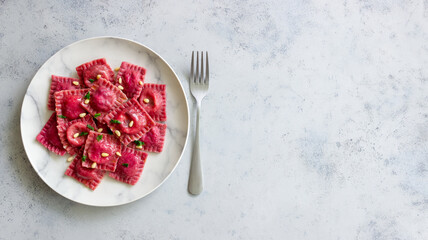 Beet ravioli with ricotta cheese, spinach and nuts. Healthy eating. Vegetarian food. Italian cuisine.