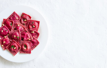 Beet ravioli with ricotta cheese, spinach and nuts. Healthy eating. Vegetarian food. Italian cuisine.
