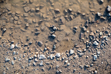 pattern of a puddle with stones