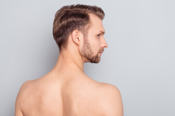 Naklejka premium Rear back behind view portrait of attractive nude man modern complexion isolated over grey pastel color background