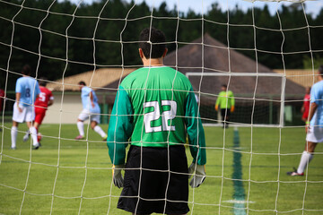 Goleiro em partida de futebol
