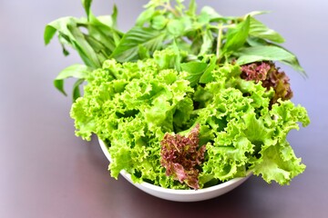 Close-Up View of Fresh Organic Vegetables in White Bowl
