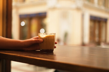 headlight of a retro car close-up. burgundy retro car on the street. stylish vintage car in red