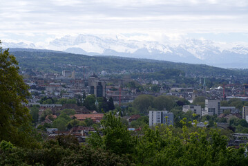Zurich skyline at springtime with mountains in the background. Photo taken May 26th, 2021, Zurich, Switzerland.