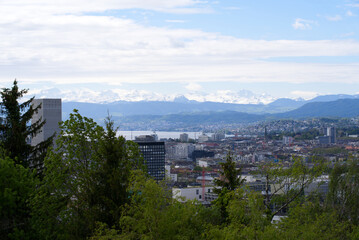Zurich skyline at springtime with Lake Zurich and Swiss alps in the background. Photo taken May 26th, 2021, Zurich, Switzerland.