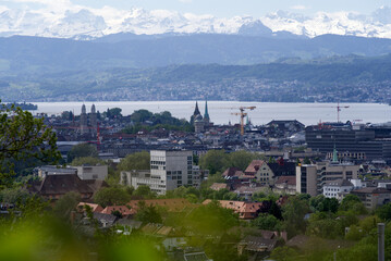Zurich skyline at springtime with Lake Zurich and Swiss alps in the background. Photo taken May 26th, 2021, Zurich, Switzerland.