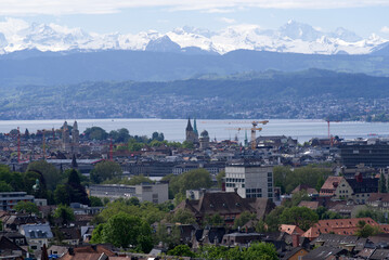Zurich skyline at springtime with Lake Zurich and Swiss alps in the background. Photo taken May 26th, 2021, Zurich, Switzerland.
