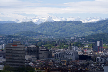 Zurich skyline at springtime with mountains in the background. Photo taken May 26th, 2021, Zurich, Switzerland.