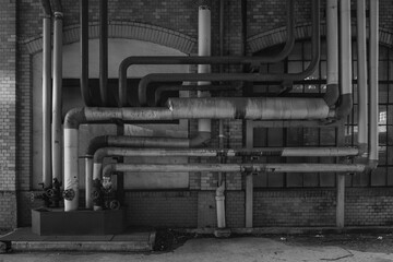 Old pipes on an industrial facade, BLACK AND WHITE PHOTO