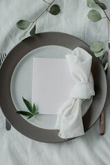 Cannabis friendly dinner concept. Beautiful dinner setup with marijuana leaves and a note for menu. Copy space. 
