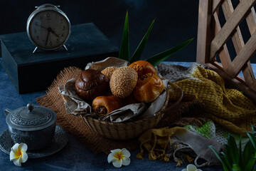 bread of various shapes and flavors collected in a basket.