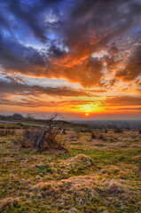 Colorful spring sunset with Sun rays coloring the clouds