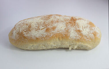 Delicious homemade, fresh baked loaf of bread on white background. 