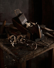 Old carpentry tools on wooden table