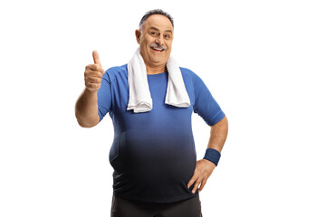 Fototapeta premium Mature man in sportswear with a towel showing thumbs up