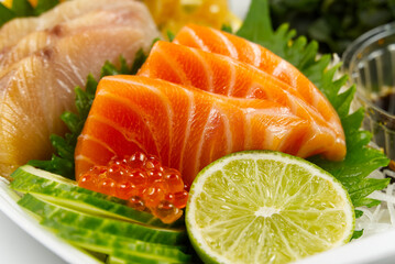 sashimi set, Japanese food. sushi restoran menu. Japanese seafood. sashimi set on plate with cucumber and salad. Takea way sashimi set.