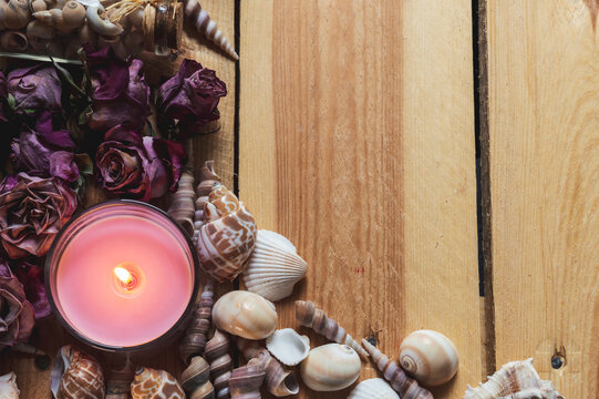 Overhead image of a burning pink candle