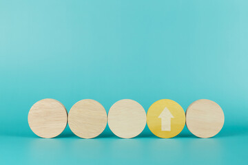Wooden sphere with arrow pointing up outstanding. Concept of different thinking idea_1