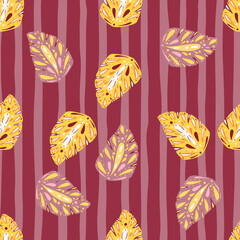Fototapeta na wymiar Yellow and pink colored folk monstera seamless pattern. Pink striped background. Floral summer backdrop.