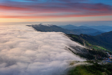 Obraz premium Aerial view of fog over mountains in morning.