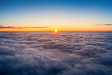 View of over clouds panorama at sunrise.