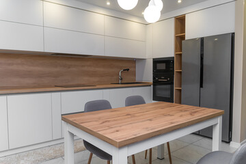 Beautiful modern minimalistic interior of a bright kitchen