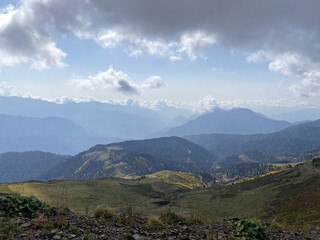 Obraz premium View from the trekking trail Rosa Khutor Ski Resort, Sochi, Russia. Roza Pik is the summit of the Aibga mountain range, which is located at an altitude of 2320 m.