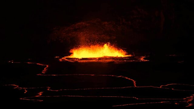 Hot lava boils in the crater of the volcano