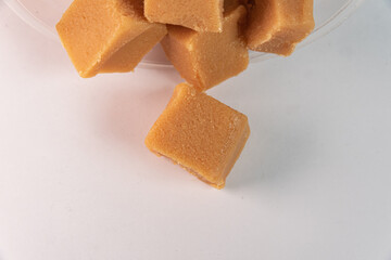 Cubes of dulce de leche on the white background