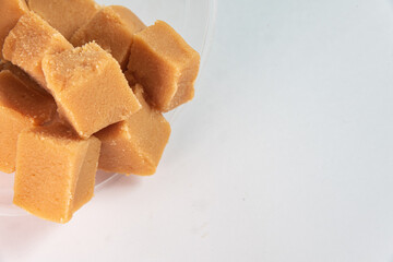 Cubes of dulce de leche on the white background