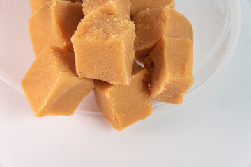 Cubes of dulce de leche on the white background