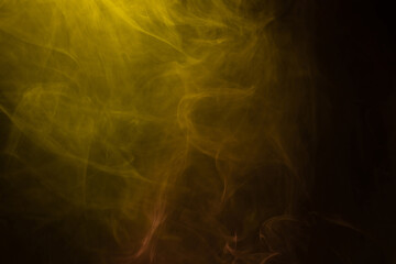 Yellow and pink steam on a black background.