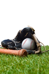 Baseball bat,shoes, glove and ball on green grass field. Sport theme background with copy space for...