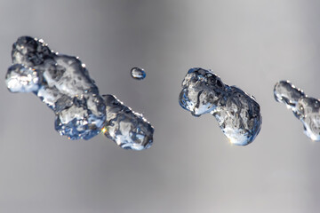 flying drops of water fountain close up
