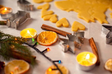 Christmas decorations on the table near flat cut dough ready for baking. Christmas preapretions