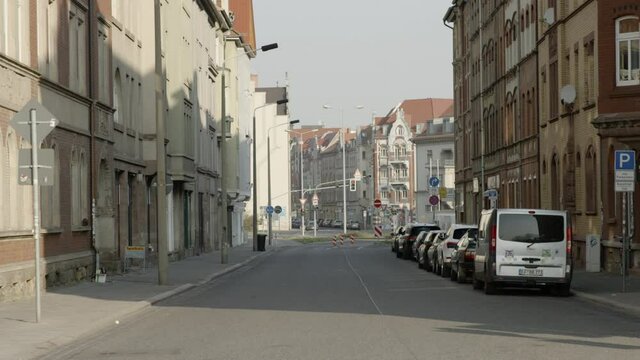 Lockdown Of A Quiet City Street In A Historic German Neighborhood, With Brick Townhomes On Both Sides Of The Street - Erfurt, Germany