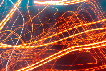 red light lines painting, long exposure photography, abstract waves against a dark background. Long exposure photo taken on a road - Powered by Adobe