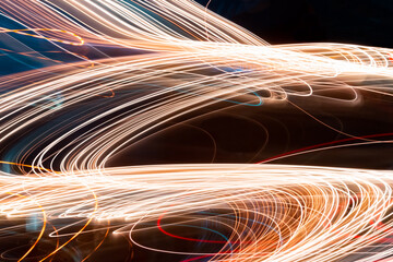 Modern light art. Long exposure neon lights texture. Long exposure light background with numerous abstract lines.