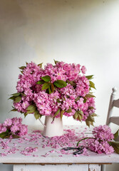 Beautiful bouquet pink flowers. lilac flowers. cherry flowers in vase .